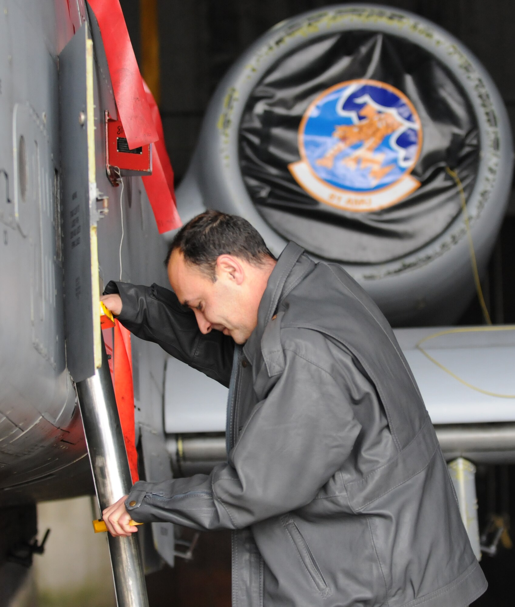 SPANGDAHLEM AIR BASE, Germany – Bulgarian air force Lt. Col. Spas Erev, air traffic control chief, climbs down from the cockpit of an A-10 Thunderbolt II after a brief explaining the pilot’s interaction with air traffic controllers here Feb. 16. Colonel Erev visited from Graf Ignatievo Air Force Base, Bulgaria, with other members of the Bulgarian air force to become more familiar with U.S. Air Force air traffic control operations. (U.S. Air Force photo/Airman 1st Class Matthew Fredericks)