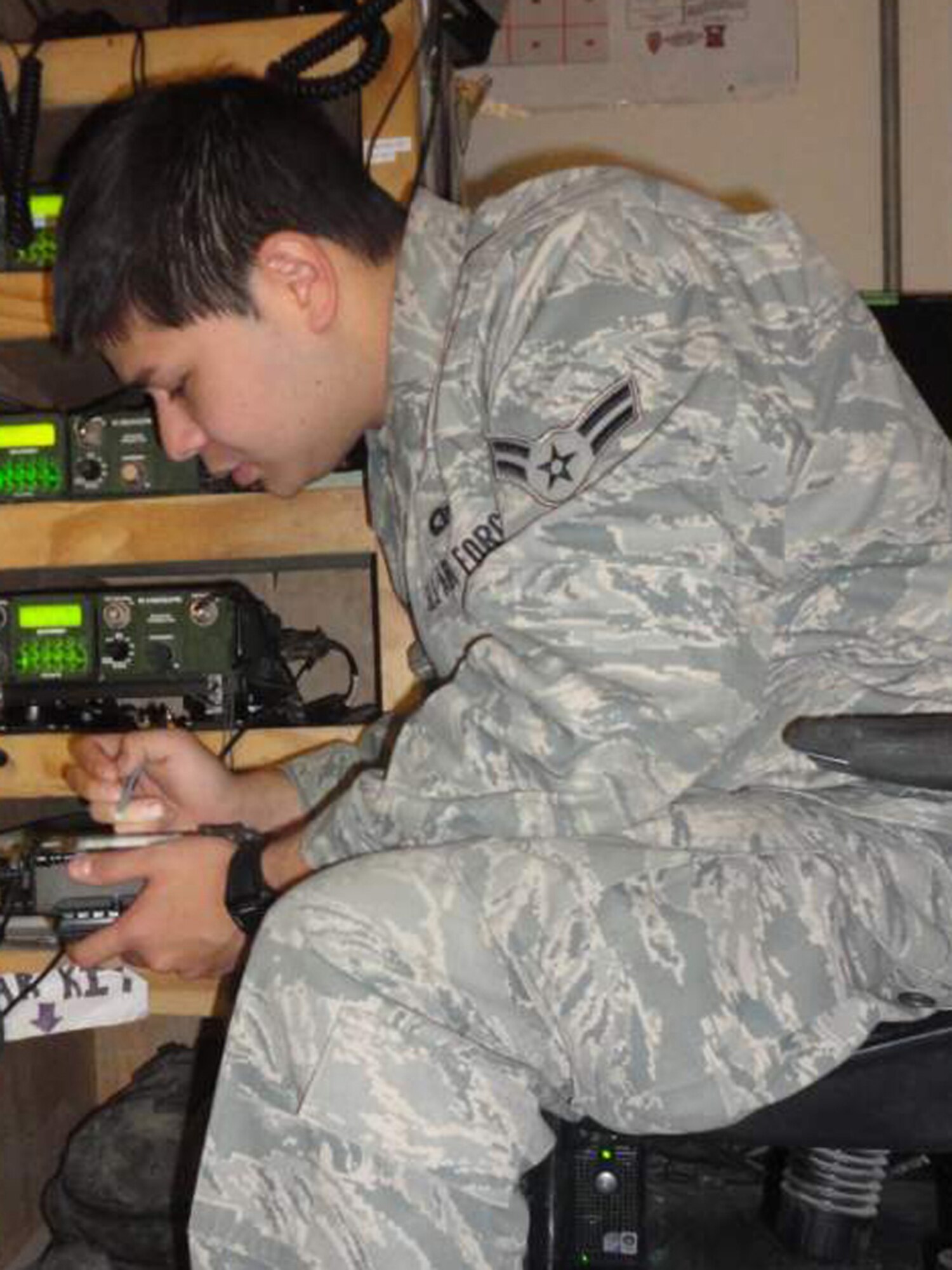 BAGRAM AIR BASE, Afghanistan - Airman 1st Class Anthony Fountain, 56th Rescue Squadron aviation resource manager, deployed to the 83rd Expeditionary Rescue Squadron, installs security equipment on communications gear Feb. 1. Airman Fountain was nominated for a Liberty Spotlight because he demonstrates the core value of 'Excellence in All We Do.' (U.S. Air Force photo courtesy of Capt. T. Renee Bernecker)