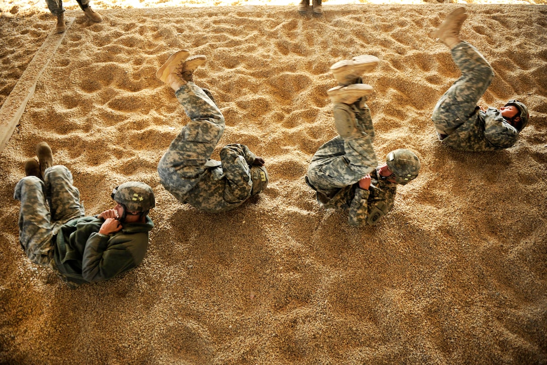 U.S. Army paratroopers practice a parachute landing and falling on Pope Air Force Base, N.C., Feb. 9, 2011.