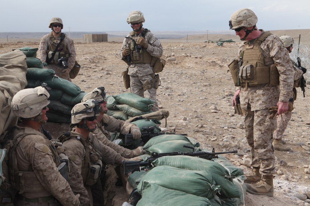 U.S. Marine Corps Major Gen. Richard Mills, Commanding General, Regional Command (Southwest), speaks to Marines from 3rd Platoon, Company L, Battalion Landing Team 3/8, 26th Marine Expeditionary Unit, Regimental Combat Team 8, while they stand post near Combat Outpost Ouellette, Helmand province, Afghanistan, Feb. 19, 2011. Elements of the 26th Marine Expeditionary Unit deployed to Afghanistan to provide regional security in Helmand province in support of the International Security Assistance Force.