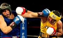 Air Force Senior Amn. Kent Brinson Jr., Fort Carson, Colo., and Army Staff Sgt. Charles Blackwell, Tucson, Ariz., battle for the title during the 2011 Armed Forces Boxing Championship Feb. 18 at Lackland Air Force Base, Texas. Blackwell won the bout, outscoring Brinson 18-15. He now gets the opportunity to compete at the U.S. Olympic trials. (U.S. Air Force photo/Tech. Sgt. Rey Ramon)