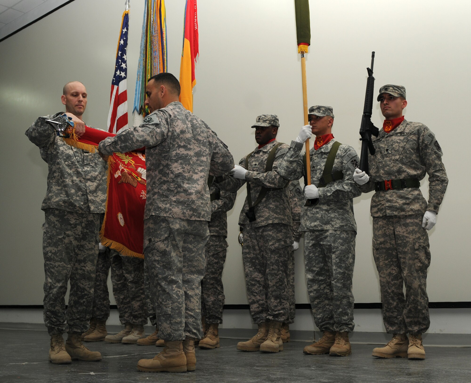 Lt. Col. Douglas Waddingham and Command Sgt. Maj. Jose Villarreal case the 3rd Battalion, 43rd Air Defense Artillery Regiment's colors at the transfer of authorityh ceremony in Southwest Asia Feb. 4.  (U.S. Army photo/Sgt. Maria Asenbrener)