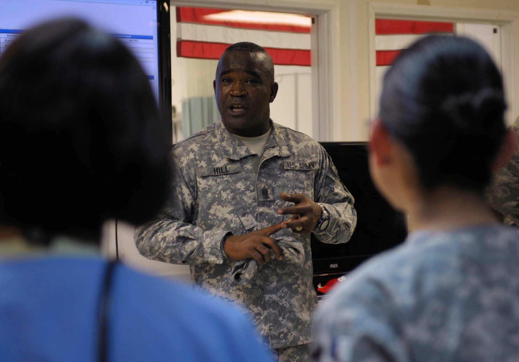 International Security Assistance Force and U.S. Forces Afghanistan Senior Enlisted Leader, Command Sergeant Maj. Marvin Hill and television talk-show host, Montel Williams visit with Airmen deployed to Bagram Airfield, Afghanistan, 19 Feb. During their visit accompanied by Mr. Mark "Ranger" Jones and Col. (Ret) Bob Ulin they talked to Airmen about their deployments and thanked them for their service. (U.S. Air Force photo by Tech. Sgt. Michael Voss)  