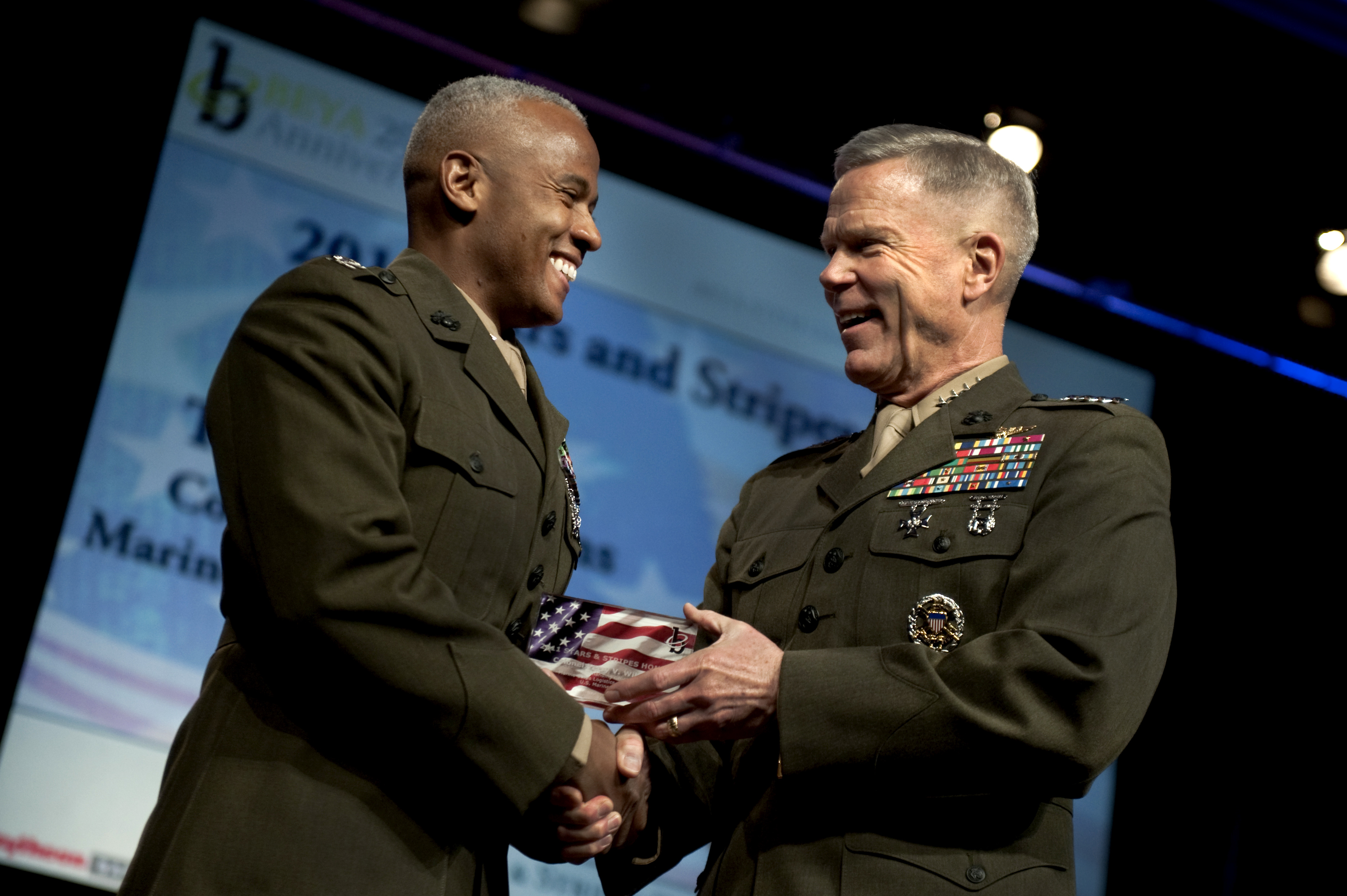 Commandant Of The Marine Corps Gen James F Amos Congratulates Col Terry V Williams Commanding Officer