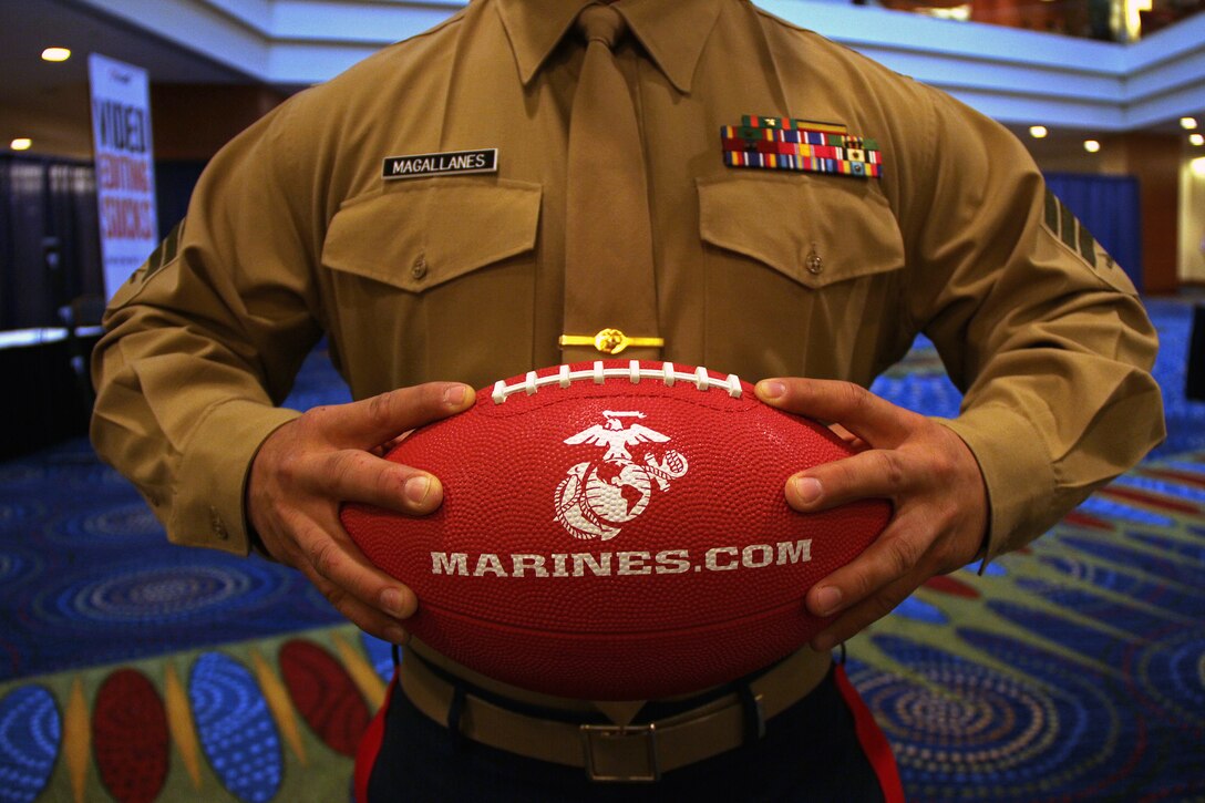 Sgt. Nicolas Magallanes, a recruiter out of the Bloomington, Minn., office, waits for coaches to arrive at the Marriott Hotel for the 2011 Minneapolis Glazier Clinic Feb. 20. More than 1,000 football enthusiasts from across the Midwest attended the conference. Several Marines attended the event to interact with coaches and offer to set up combat fitness tests for their athletes. For more photos of the event, visit the Recruiting Station Twin Cities fan page at www.facebook.com/rstwincities.
