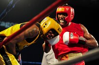 U.S. Marine Corps Cpl. Damarias Russell (right), defeated U.S. Army Spc. Zacchaeus Hardrick (left) during their 2011 Armed Forces Boxing Championships finals bout Feb. 18 at Lackland Air Force Base, Texas. Winning a gold medal at the event qualifies the athlete to compete in the 2012 Olympic team trials. (U.S. Air Force photo/Senior Amn. Marleah Miller)