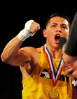 U.S. Army Sgt. Toribio Ramirez, the 2011 Armed Forces Boxing Champion in his 132 lb. weight class, celebrates after defeating U.S. Marine Corps Lance Cpl. Tommy Roque Feb. 18 at Lackland Air Force Base, Texas. Ramirez will now compete for a chance to represent the United States at the 2012 Olympic Games in London. (U.S. Air Force photo/Senior Amn. Marleah Miller)