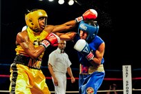 U.S.  Army Sgt. John Franklin (left) defeated U.S. Marine Corps Cpl. Alex Diaz (right) during the 2011 Armed Forces Boxing Championships finals bout Feb. 18 at Lackland Air Force Base, Texas. Franklin will now compete for a spot on the men's U.S. Olympics national boxing team. (U.S. Air Force photo/Senior Amn. Marleah Miller)