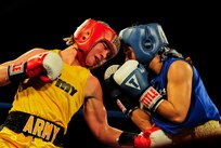 U.S. Army Spec. Carrie Barry (left), the third-ranked lightweight in the nation, defeated U.S. Marine Corps Lance Cpl. Melissa Parker (right), former three-time national champion, during the 2011 Armed Forces Boxing Championships finals bout Feb. 18 at Lackland Air Force Base, Texas. Barry's victory earns her a trip to the U.S. Olympic trails where she will compete for a spot on the women's U.S. Olympics national boxing team. Women's boxing makes its debut at the 2012 Olympic Games in London. (U.S. Air Force photo/Senior Amn. Marleah Miller)