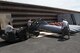 TSgt. Scott Flesher (left) drives a Jammer and prepares to drop off a wing tank for storing in preparation for the Dissimilar Air Combat Training (DACT) mission at the Williamtown Royal Australian Air Force (RAAF) Base, Australia on February 19, 2011.  The 132FW and 185ARW are conducting a Dissimilar Air Combat Training (DACT) mission 