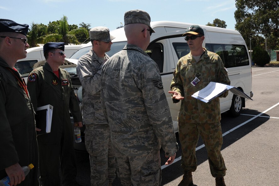 FSgt. Gavin Willmet (far right), road movements officer at Williamtown Royal Australian Air Force (RAAF) Base, Australia, instructs members of the 132nd Fighter Wing (132FW), Des Moines, Iowa, and members of the 185th Air Refueling Wing (185ARW), Sioux City, Iowa on how to drive in Australia on February 19, 2011.  The 132FW and 185ARW are conducting a Dissimilar Air Combat Training (DACT) mission for approximately one month with the RAAF.  (US Air Force photo/Staff Sgt. Linda E. Kephart)(Released)