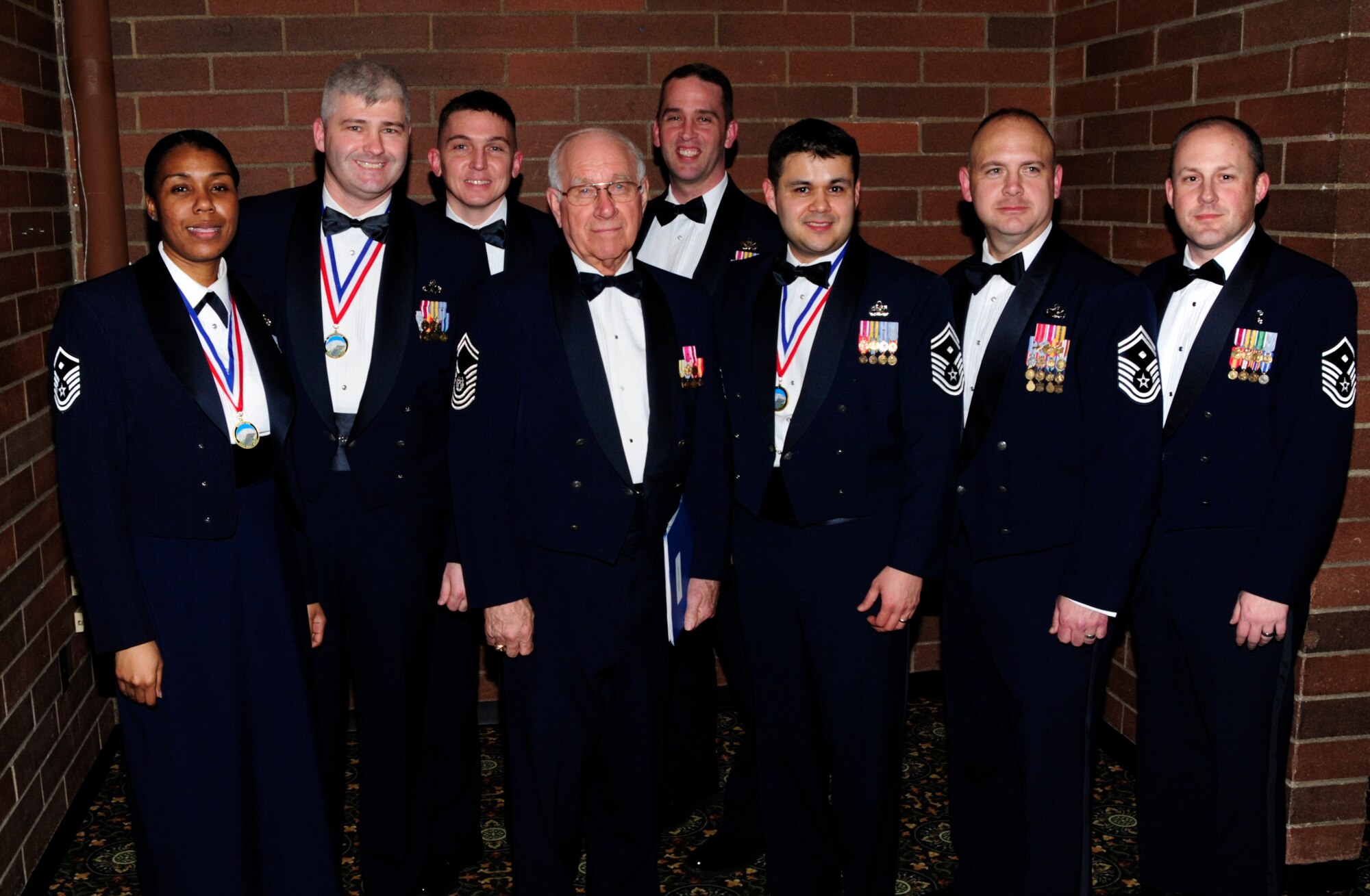The eighth Chief Master Sergeant of the Air Force, Sam Parish, with annual award recipients and first sergeants at the 2010 Annual Awards Banquet Feb. 17 at Joint Base Lewis-McChord, Wash. Twelve awards were received in categories such as Non Commissioned Officer, Key Spouse and Junior Company Grade Officer. (U.S. Air Force photo/Master Sgt. Chris Haylett)