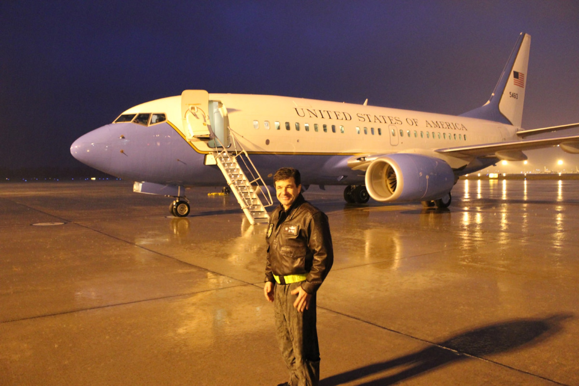 Commander of the 932nd Airlift Wing, Col. William Edwards, Jr., flew on an evening training flight with a mixed crew of active duty and Air Force Reserve members, part of the Total Force Integration (TFI) at Scott Air Force Base.  The wing maintains the C-40C aircraft seen in the background.  (U.S. Air Force photo/Maj. Stan Paregien)