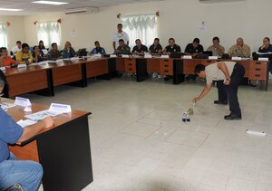 SOTO CANO AIR BASE, Honduras – Joint Task Force-Bravo joined several Honduran first responders in a course geared toward a unified plan for reaction during disasters and crisis. Instructor Edgar Lopez, Costa Rica Fire Department, uses models during a scenario to test the participants’ knowledge gained through the course. JTF-Bravo is committed to full partnerships with Central American governments in training and missions to support security, stability and prosperity throughout the region. (U.S. Air Force photo/Staff Sgt. Kimberly Rae Moore)