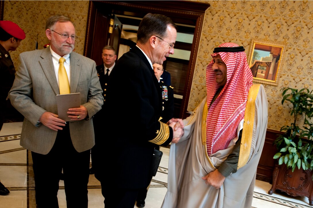 U.S. Ambassador to Saudi Arabia James B. Smith, left, and U.S. Navy Adm. Mike Mullen, chairman of the Joint Chiefs of Staff, center, bid farewell after meeting with Saudi Arabian Prince Khalid bin Sultan bin Abdul Aziz al-Saud, assistant defense and aviation minister for military affairs, in Riyadh, Saudi Arabia, Feb. 21, 2011. 