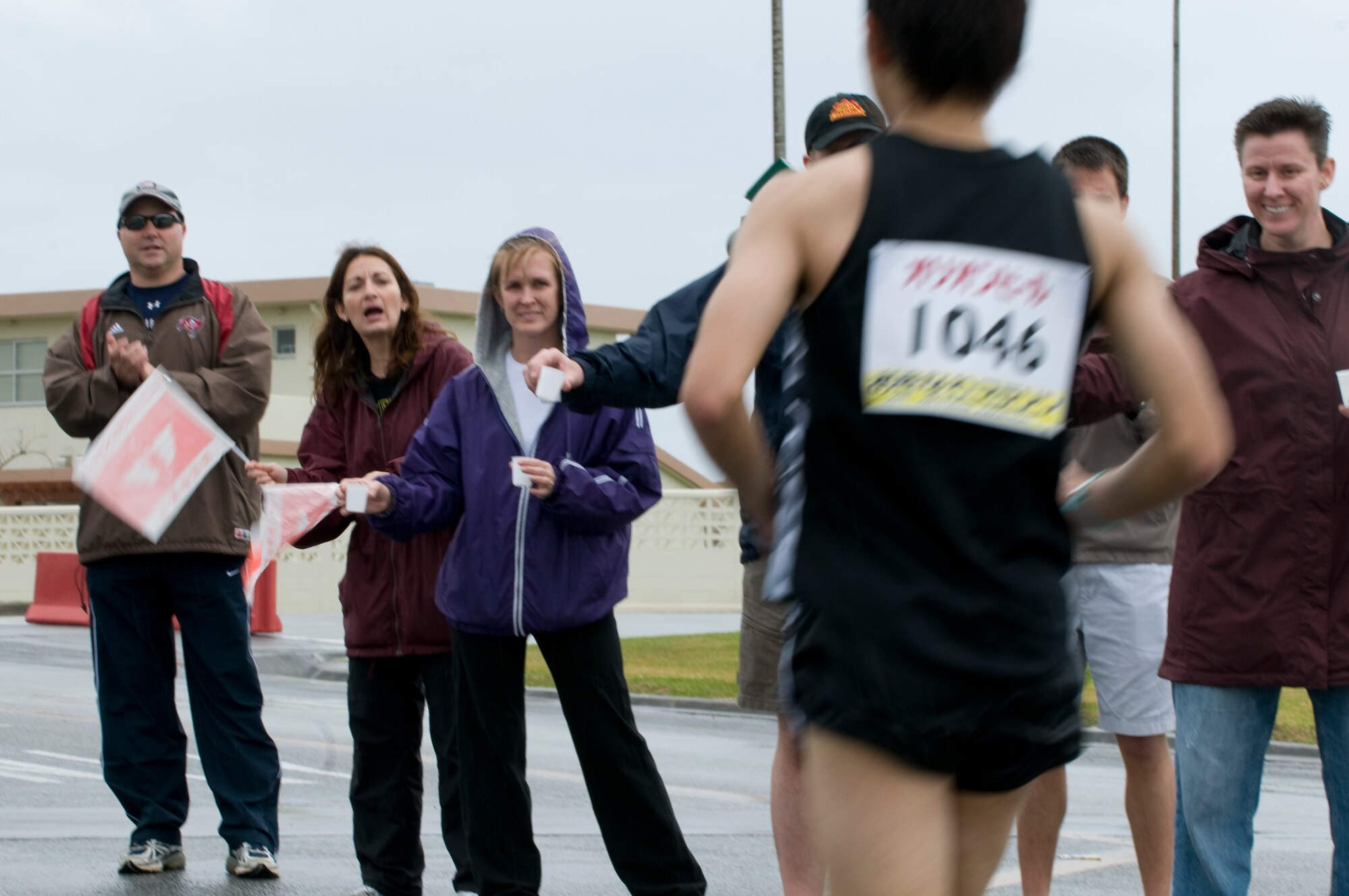 A group of volunteers lend extra support during the 1.5 miles that the 2011 Okinawa Marathon stretched through Kadena, Feb. 20. The marathon was a 26.6 mile journey winding its way through several towns and villages on the island. (U.S. Air Force photo/ Brooke P. Beers)