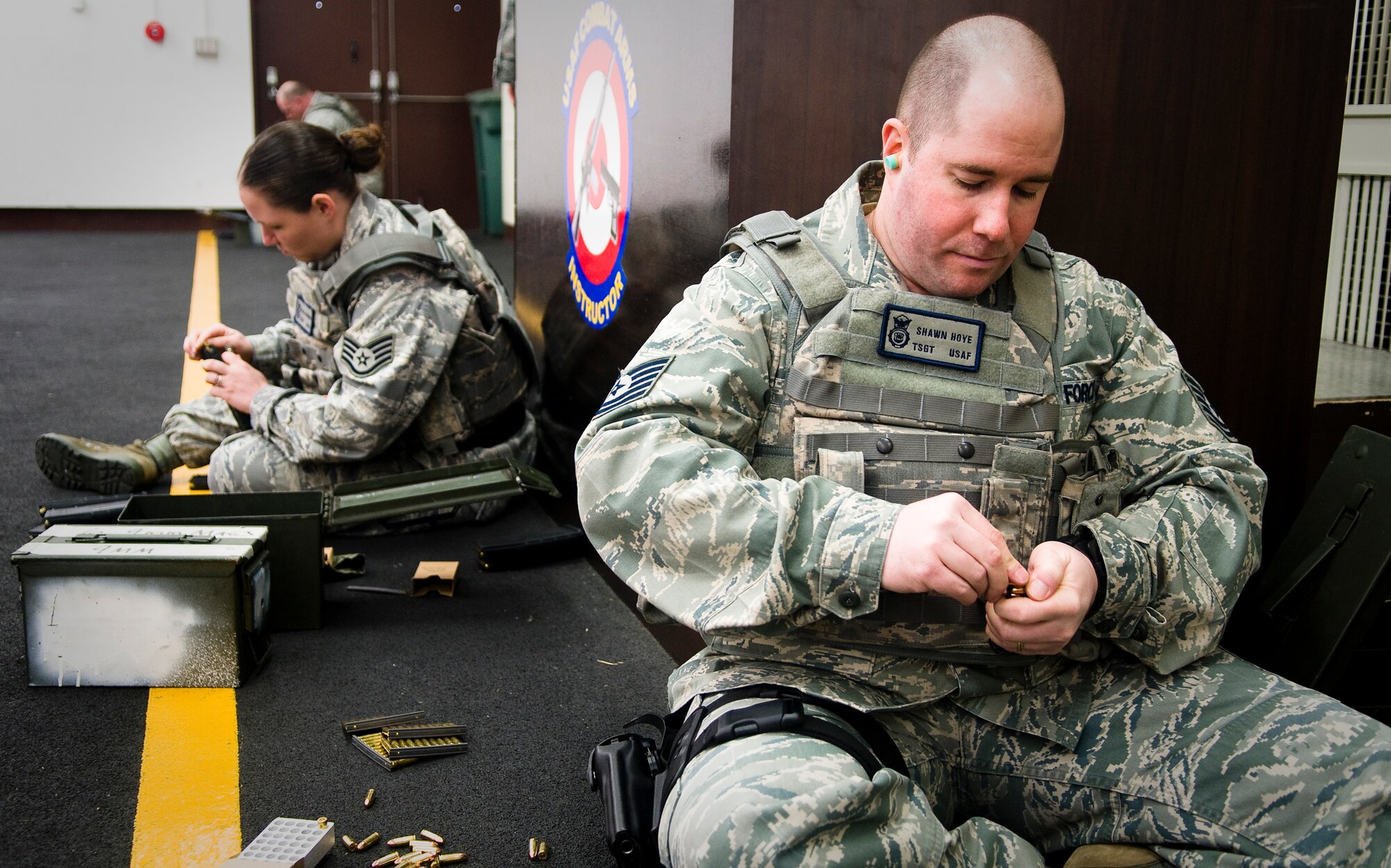 YOKOTA AIR BASE, Japan -- Tech. Sgt. Shawn Hoye, 374th Security Forces Squadron patrolman, loads M-9 rounds into a magazine during proficiency training prior to shooting at the small-arms range here Feb. 22. Members fired both the M-9 and the M-4 during the training. (U.S. Air Force photo/Staff Sgt. Chad C. Strohmeyer)