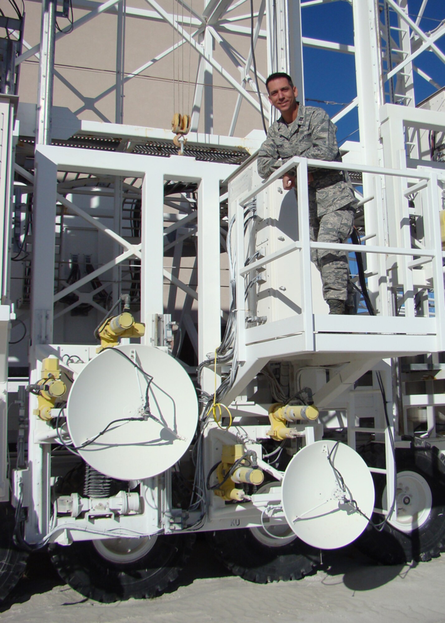 WHITE SANDS MISSLE RANGE, N.M. -- Capt. William Keichel, 46th Test Group, Detachment 2, stands on a Mobile Radar Unit used for measuring the bi-static Radar Cross Section of targets. Captain Keichel was one of five officers selected from Holloman to attend Test Pilot School at Edwards AFB, Calif. (Courtesy photo)       