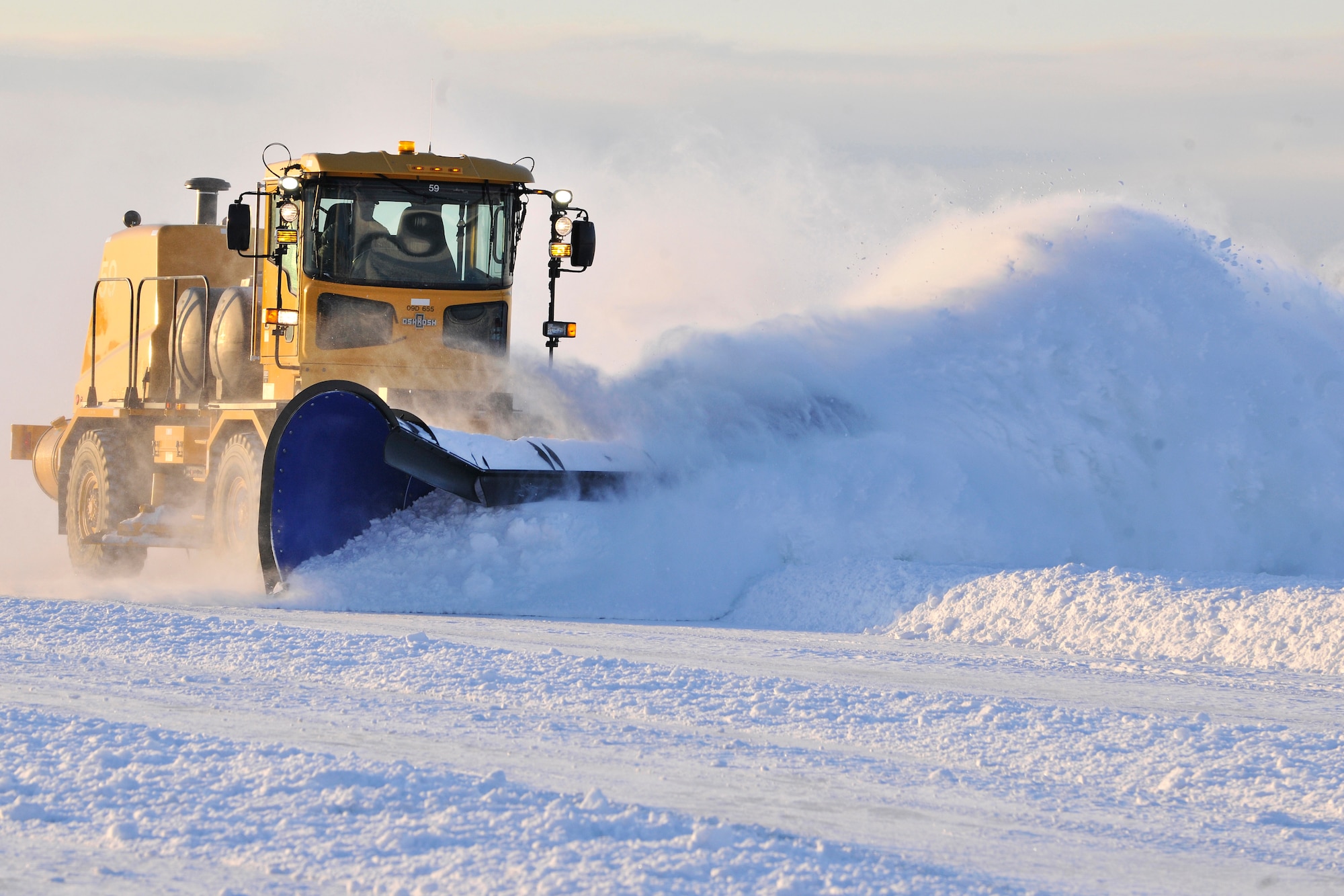 Steven Hatch removes snow from the flight line at Eielson Air Force Base, Alaska, Feb. 22, 2011. Eielson received 15-18 inches of snow over the weekend. Mr. Hatch is an engineering equipment operator assigned to the 354th Civil Engineer Squadron. (U.S. Air Force photo/Staff Sgt. Christopher Boitz)