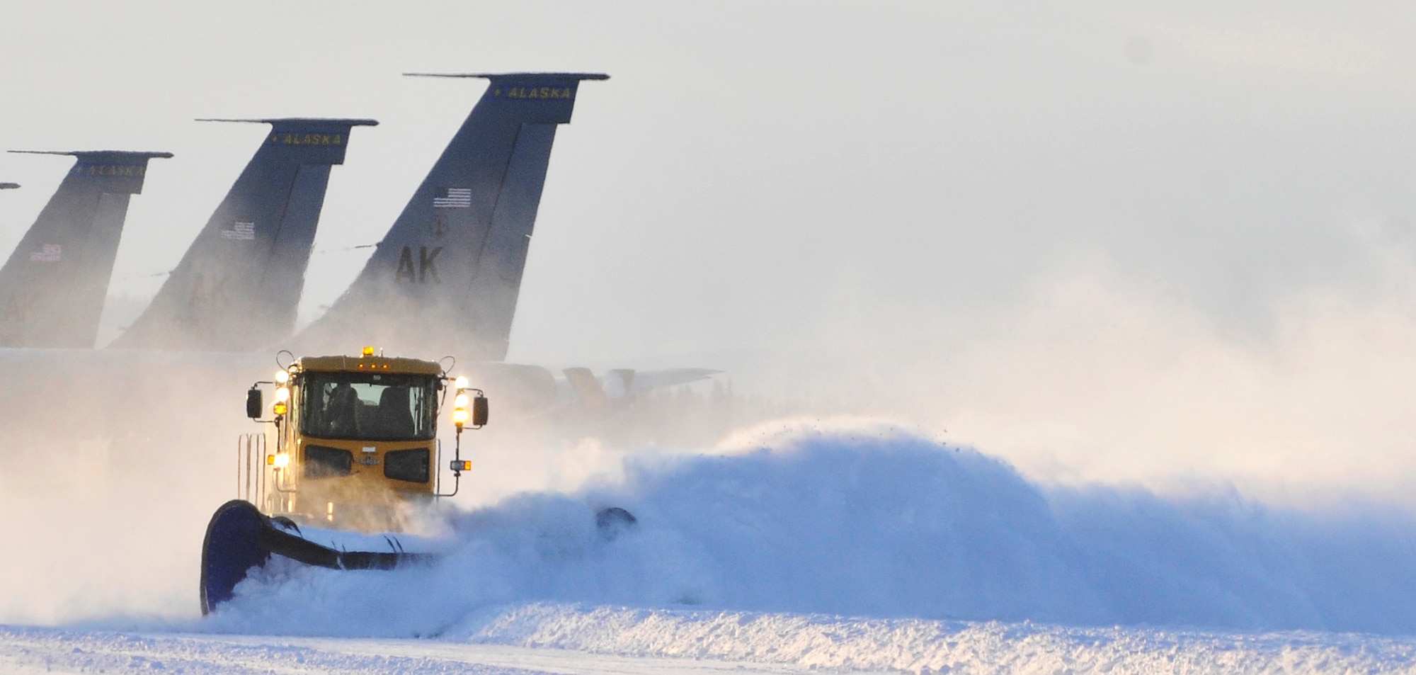 Steven Hatch removes snow from the flight line at Eielson Air Force Base, Alaska, Feb. 22, 2011. Eielson received 15-18 inches of snow over the weekend. Airmen from the 354th Civil Engineer Squadron Snow Barn enable the base to operate during incliment weather. Mr. Hatch is an engineering equipment operator assigned to the 354th Civil Engineer Squadron. (U.S. Air Force photo/Staff Sgt. Christopher Boitz)