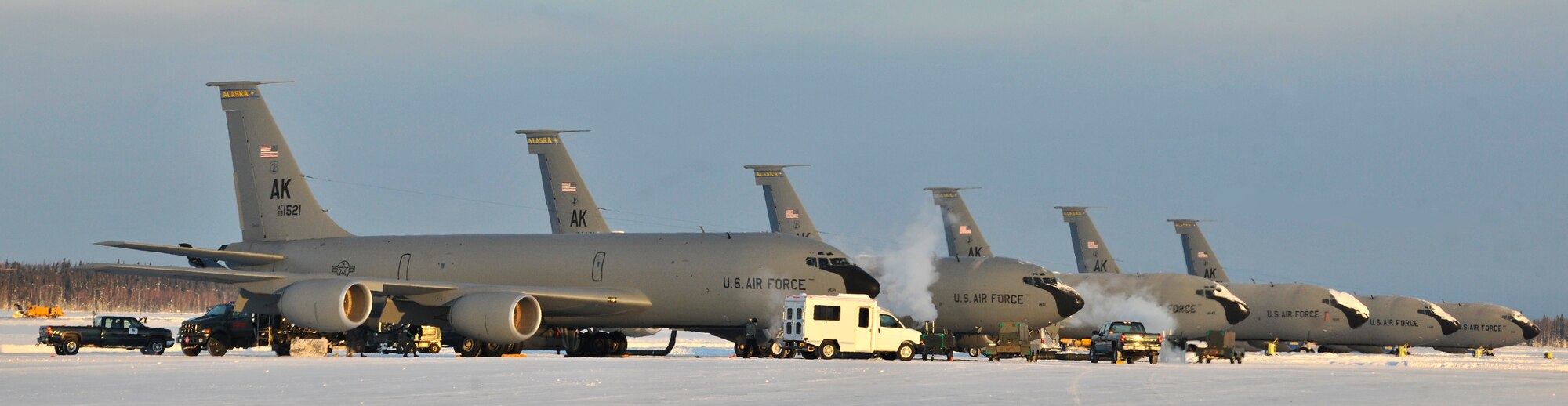 A row of KC-135 Stratotankers sit on the flight line at Eielson Air Force Base, Alaska, Feb. 22, 2011. The Stratotanker is a refueler capable of carrying up to 200,000 pounds of transferable fuel.The KC-135's are assigned to the 168th Air Refueling Wing, Alaska Air National Guard. (U.S. Air Force photo/Staff Sgt. Christopher Boitz)