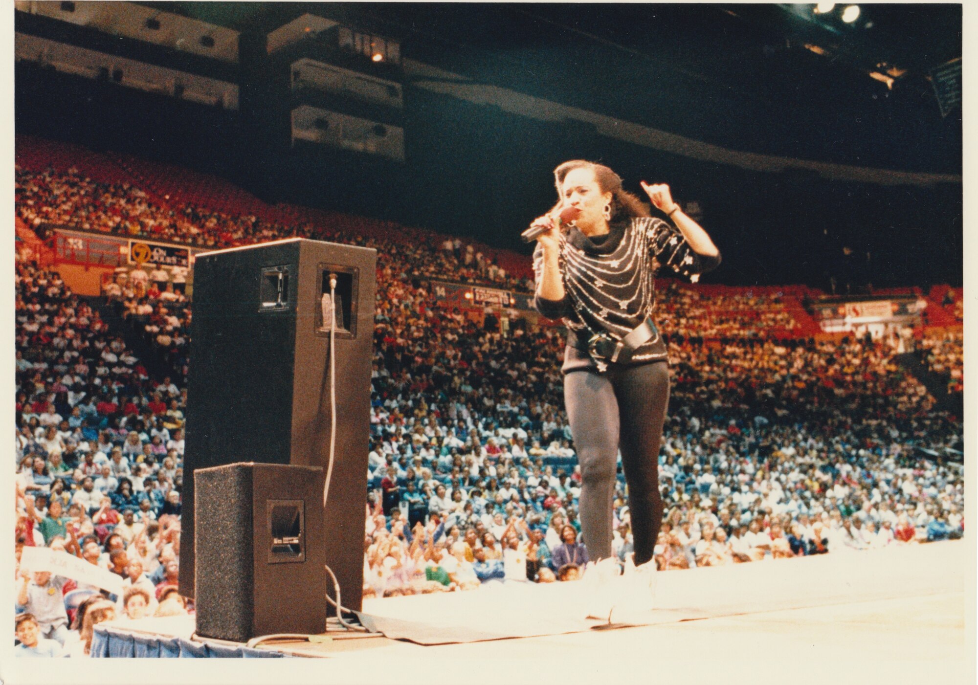 A member of The United States Air Force Band's "High Flight" performs for a crowd of thousands at the Capital Centre.  Please take a moment to reflect on the photograph shown here. If you have any insight regarding who is in it, when or where it was taken, or any stories you can share about the event, please email our Band Historian <a href="mailto:usafbandhistorian@afncr.af.mil">Tech. Sgt. Tracey MacDonald</a>. Thank you and we look forward to hearing from you!  This is Photo 43. (Unknown Photographer)