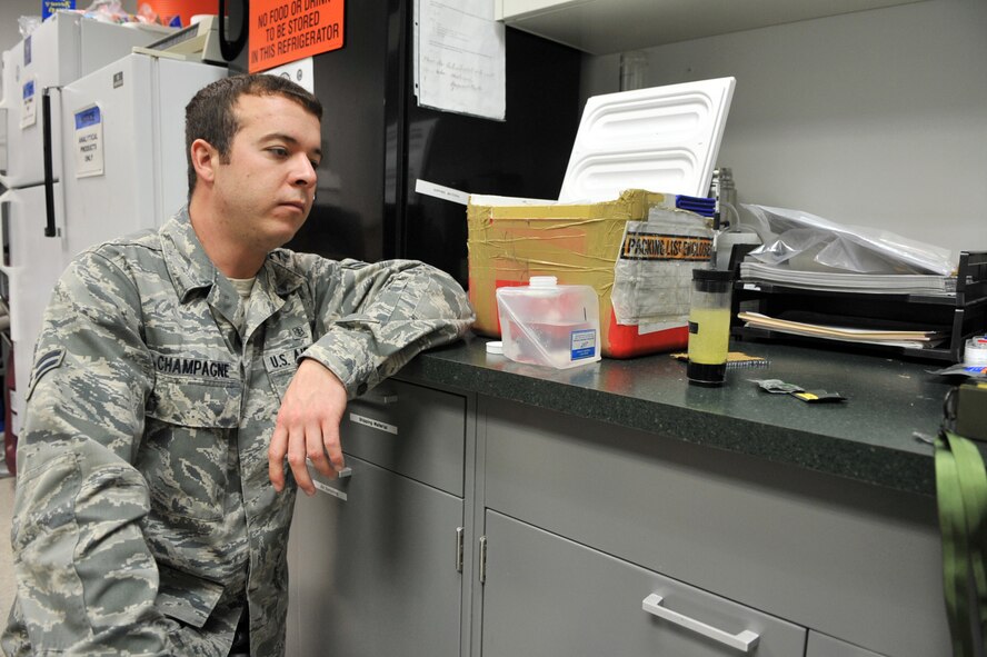 Airman 1st Class Tyler Champagne, 2nd Aerospace Medicine Squadron, waits for the results of a water sample test in the Bioenvironmental Engineering lab at Barksdale Air Force Base, La., Feb. 22. Water samples are tested weekly or as needed to ensure no contaminants are present. (U.S. Air Force photo/ Airman 1st Class Micaiah Anthony)(RELEASED)