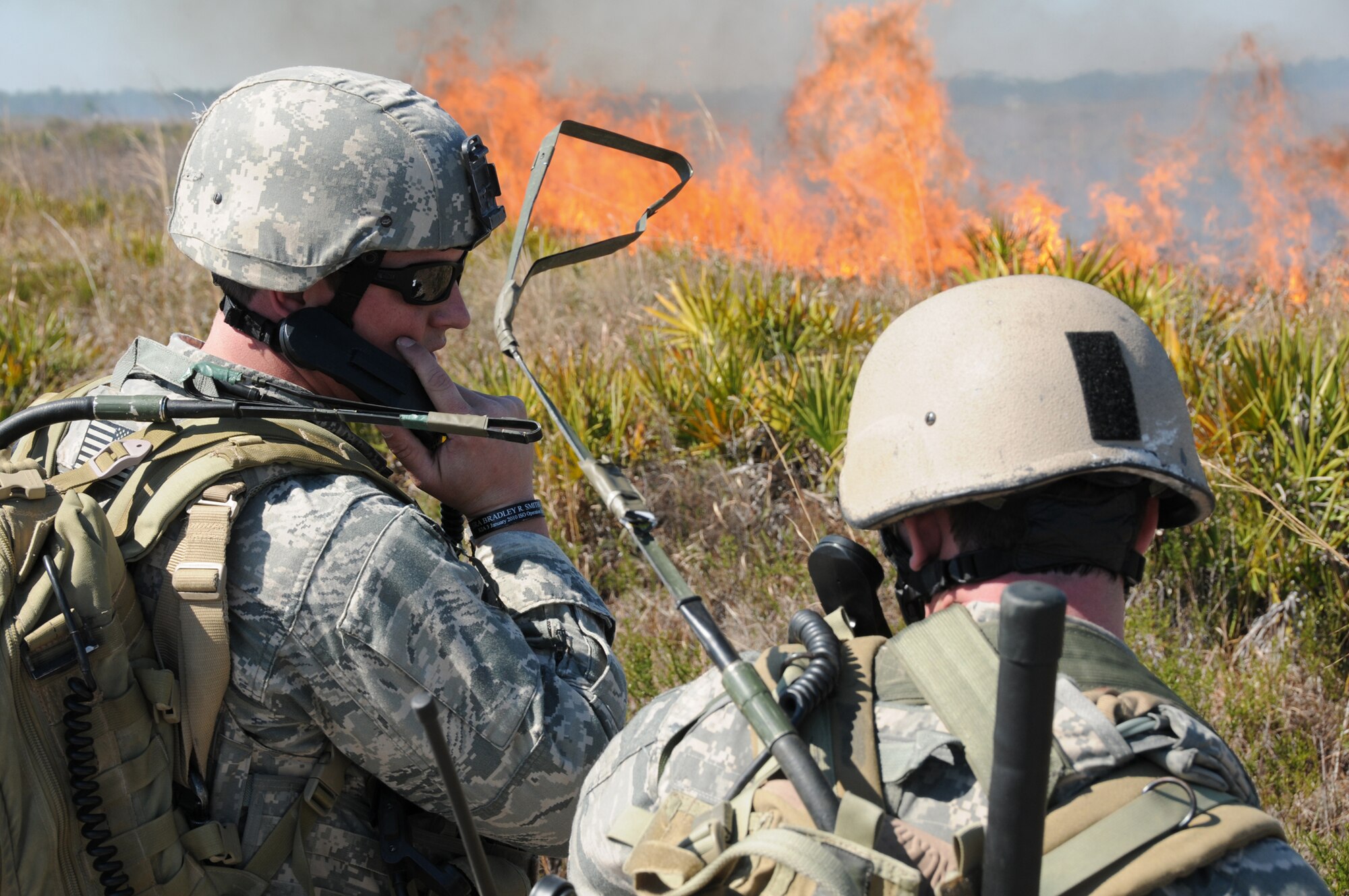 Staff Sgt. Cody McNorton and Senior Airman Joseph Flynn call in information during exercise Atlantic Strike Feb. 15, 2011, at Avon Park Air Force Range, Fla. Atlantic Strike is a coalition air-to-ground training exercise that simulates a deployed environment. Sergeant McNorton and Airman Flynn are members of the 14th Air Support Operations Squadron. (U.S. Air Force photo/Senior Airman Amber Williams)