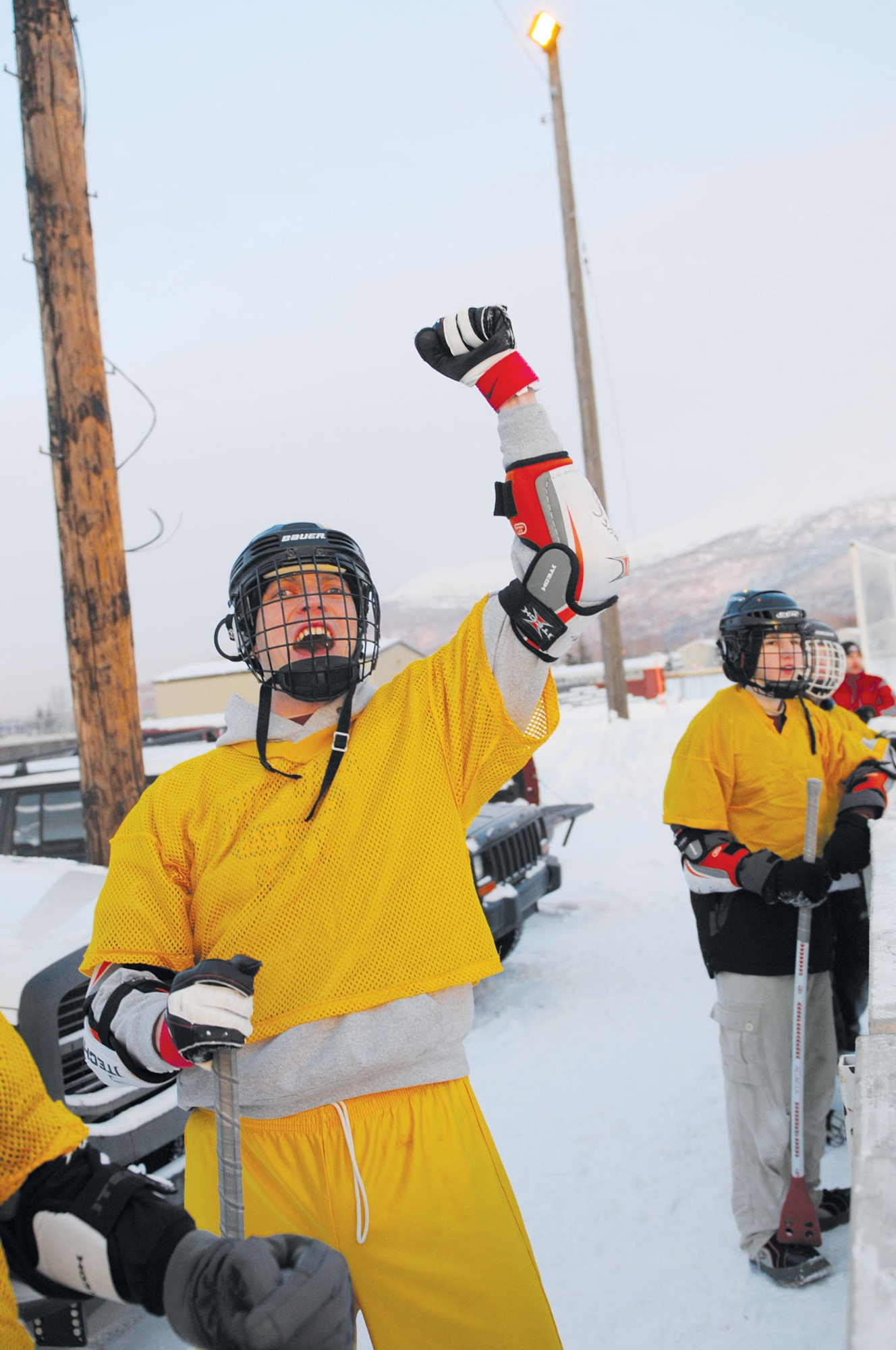 Kyle Brown, 381st Intelligence Squadron, celebrates following a goal by his team during the broomball championship, Friday at the Buckner Fitness Center recreation area. The 381st IS swept the 3/509th. (U.S. Air Force photo/Steve White)