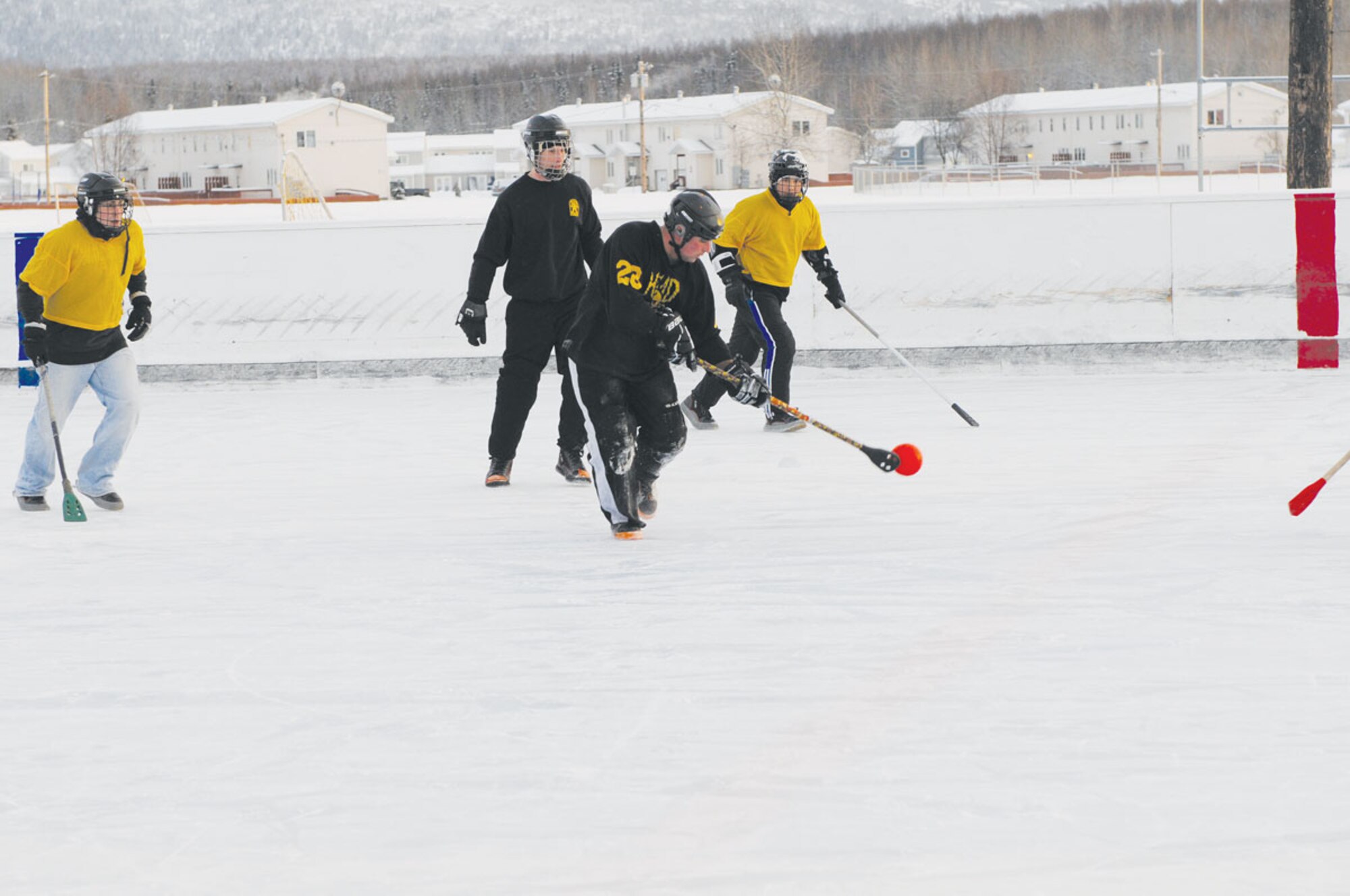 A 3/509th player attempts to pass the ball during the broomball championship. Until the 381st beat them Friday the 3/509th Company B had not lost a game all year. (U.S. Air Force photo/Steve White)