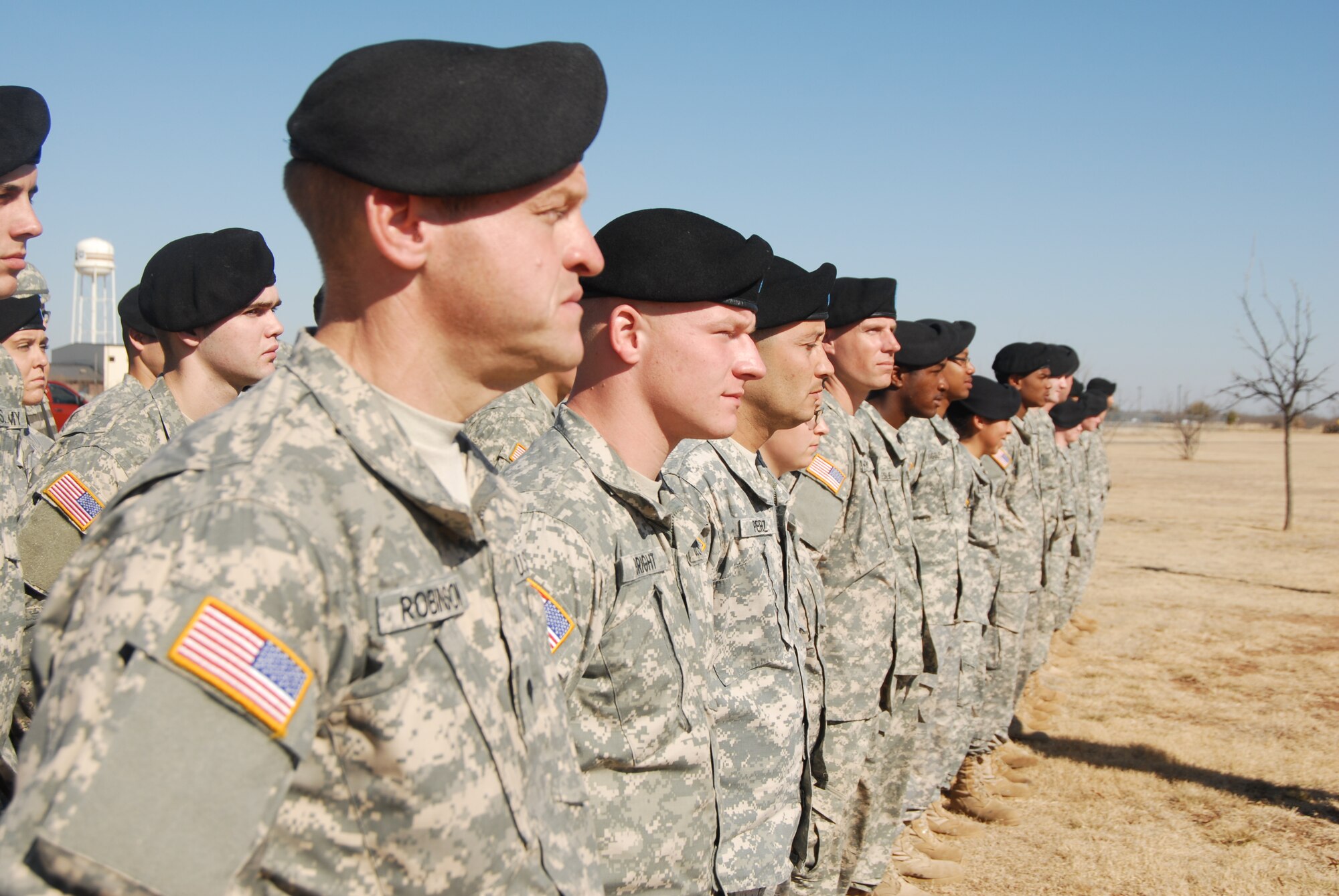 GOODFELLOW AIR FORCE BASE, Texas – Soldiers from the 344th Military Intelligence Battalion stand in formation during a memorial service held in honor of Airman 1st Class Derek Kozorosky, a firefighter stationed at Kadena Air Force Base, Okinawa, Japan. Airman Kozorosky died Feb. 11, following a tragic vehicle backing incident at the Kadena Headquarters Fire Station. (U.S. Air Force photo/Airman 1st Class Anne Gathua) 