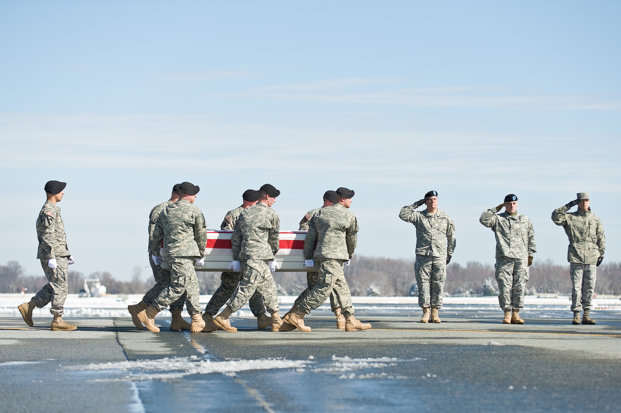 A U.S. Army carry team transfers the remains of Army 1st Lt. Daren M. Hidalgo, of York, Pa., at Dover Air Force Base, Del., Feb. 22, 2011. Hidalgo was assigned to the 3rd Squadron, 2nd Cavalry Regiment, Vilseck, Germany. (U.S. Air Force photo/Roland Balik)