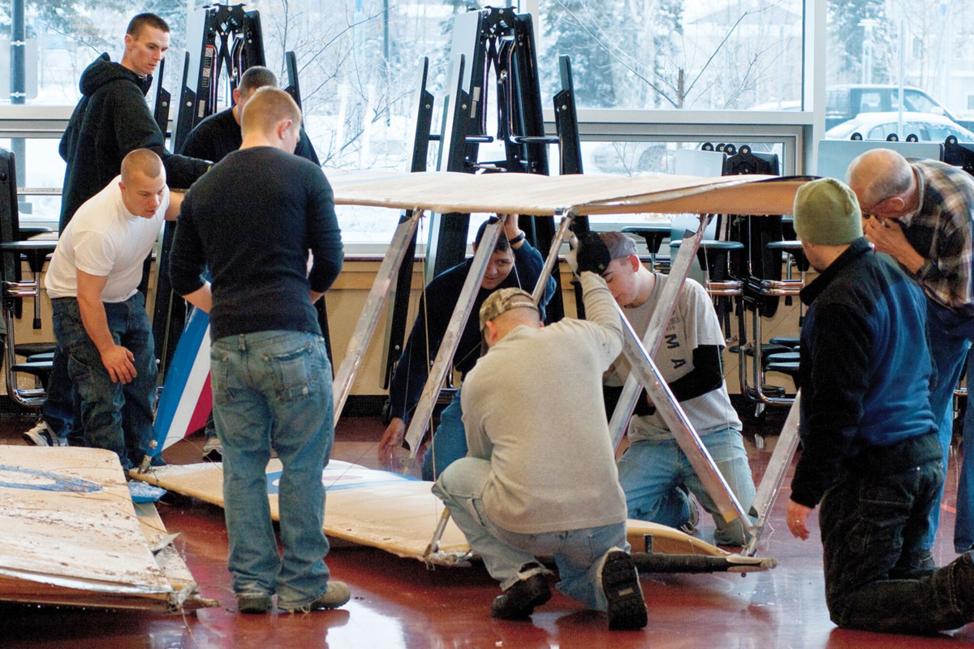 Volunters from Joint Base Elmendorf-Richardson put together an ultra-light model
plane at Begich Middle School for the Build-a-Plane program, Feb. 12. The plane was donated by the 3rd Maintenance Squadron. (U.S. Air Force photo/Airman 1st Class Jack Sanders)