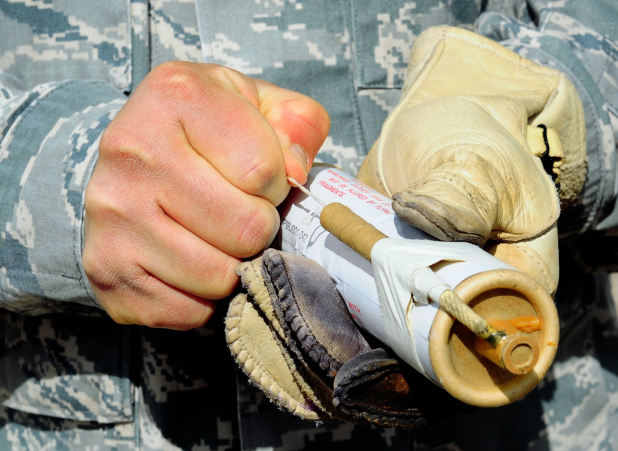 HOLLOMAN AIR FORCE BASE, N.M. -- Staff Sgt. Robert Rodriguez, 49th Material Maintenance Squadron, prepares to pull the fuse on a ground burst simulator Feb. 17, 2011. The GBS will be used by Exercise Evaluation Team members to simulate war time conditions during operational readiness exercises.  (U.S. Air Force photo by Tech. Sgt. Chris Flahive/Released)