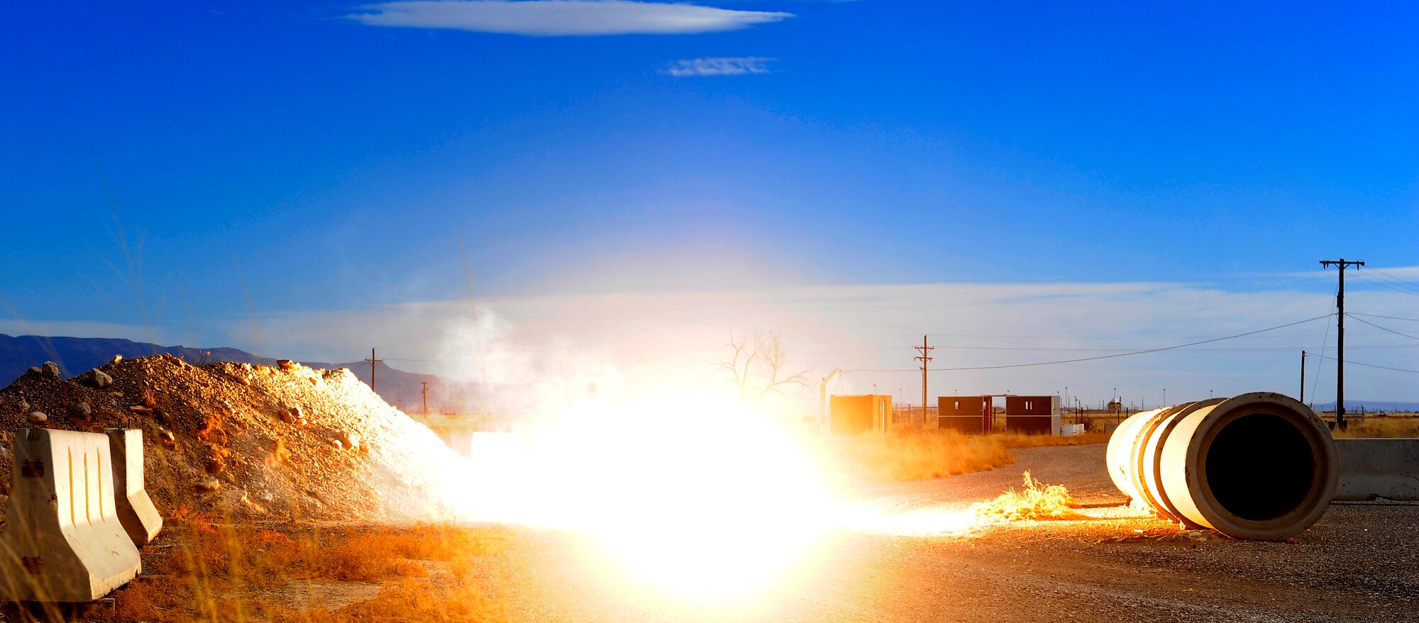 HOLLOMAN AIR FORCE BASE, N.M. -- A ground bust simulator detonates during an Exercise Evaluation Team explosives training Feb. 17, 2011. The training is an annual requirement for team members in which they learn to use the ordnance safely.  (U.S. Air Force photo by Tech. Sgt. Chris Flahive/Released)