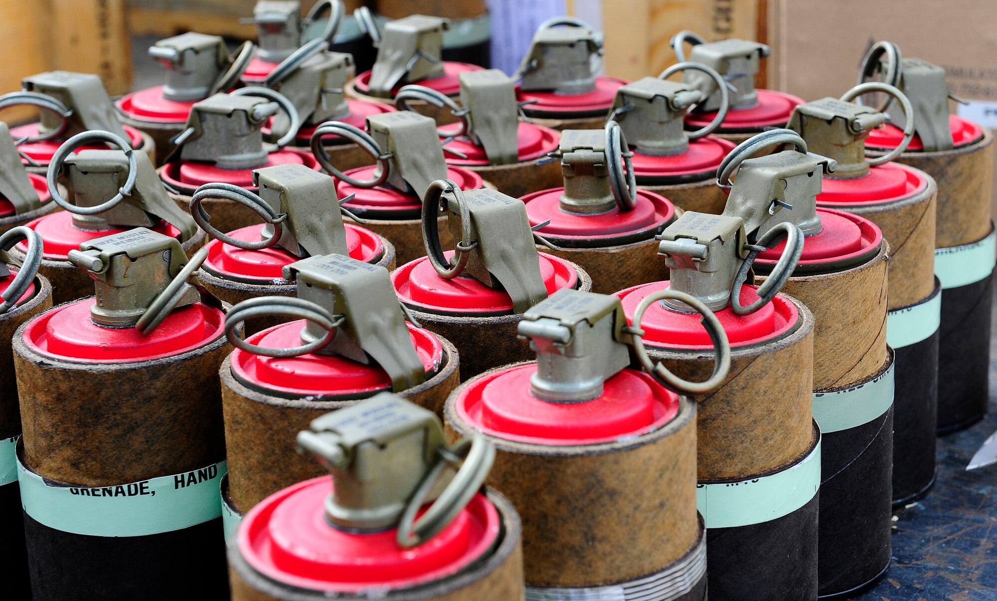 HOLLOMAN AIR FORCE BASE, N.M. -- M18 Smoke grenades sit outside the Civil Engineer pit before being used to train Exercise Evaluation Team members Feb. 17, 2011. EET members will use the smoke grenades to simulate war conditions in preparation for operational readiness exercises.  (U.S. Air Force photo by Tech. Sgt. Chris Flahive/Released)