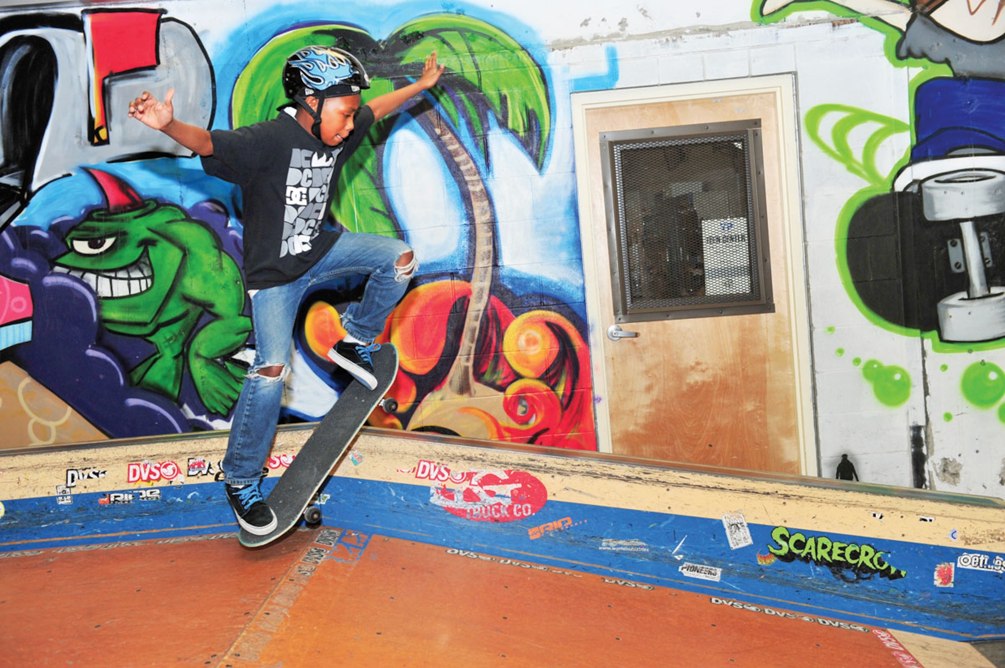 Donovan Campbell, 12, grinds along a rail during the skate demonstration, Feb 12, at the Arctic Oasis Teen Center. The demo was put together for youth to be able to see the positive influences skateboarding can bring. (U.S. Air Force photo/Senior Airman Kristin High)