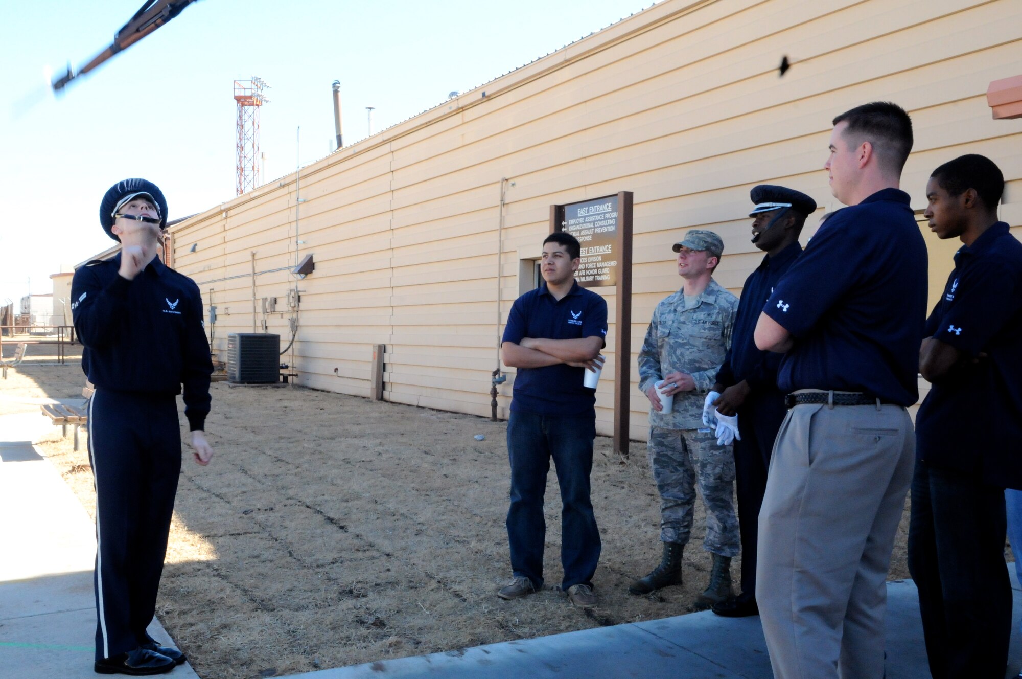 Airman 1st Class Chris Martinez, member of The U.S. Air Force Honor Guard drill team, demonstrates drill movements Feb. 16 for members of Tinker AFB, Okla. base honor guard. The drill team travels to bases around the U.S. to perform for Airmen. (U.S. Air Force photo by Airman 1st Class Tabitha N. Haynes)