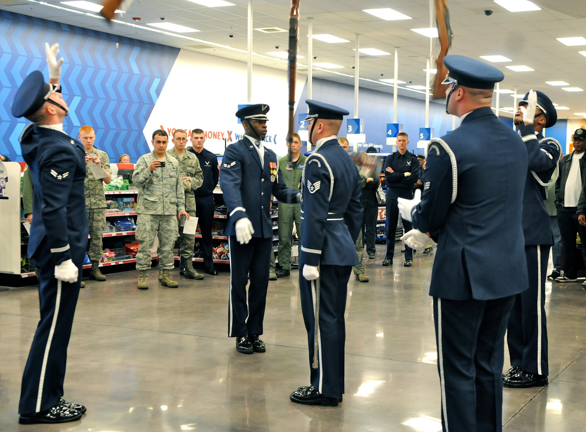 Members of The U.S. Air Force Honor Guard drill team perform Feb. 16 at the Base Exchange on Tinker AFB, Okla. The drill team performs to represent the Airmen serving around the world in the Air Force. (U.S. Air Force photo by Airman 1st Class Tabitha N. Haynes)