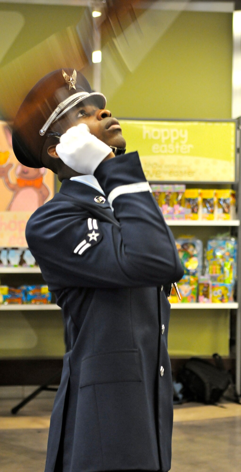 Airman 1st Class Billy Degraffenreid Jr., member of The U.S. Air Force Honor Guard drill team, tosses his M-1 rifle during the performance Feb. 16 at the Base Exchange on Tinker AFB, Okla. The drill team performs to represent the Airmen serving around the world in the Air Force. (U.S. Air Force photo by Airman 1st Class Tabitha N. Haynes)