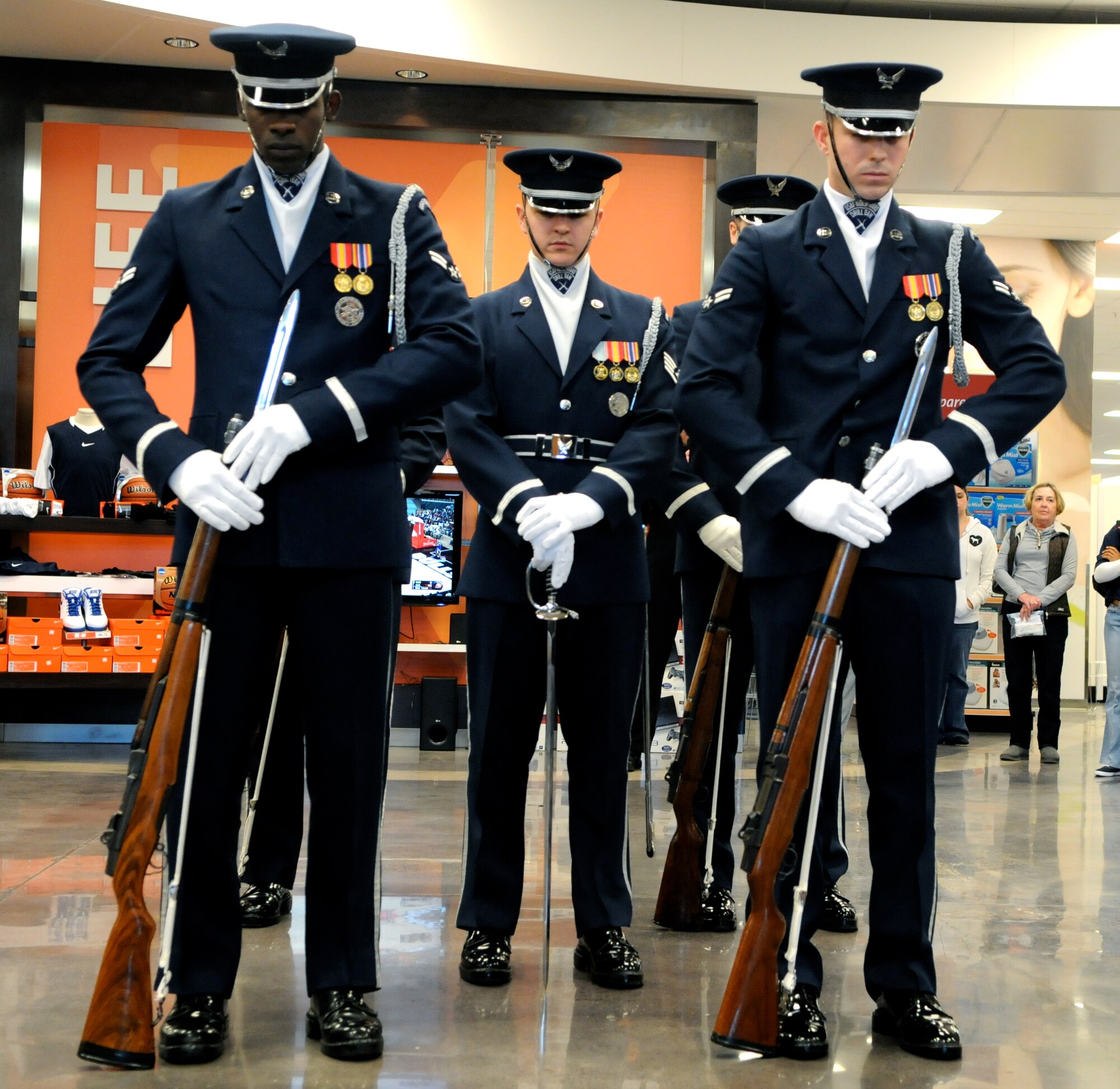 Members of The U.S. Air Force Honor Guard drill team perform Feb. 16 at the Base Exchange on Tinker AFB, Okla. The drill team performs to represent the Airmen serving around the world in the Air Force. (U.S. Air Force photo by Airman 1st Class Tabitha N. Haynes)