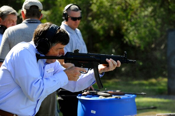 Retired Col. Tucker Fagan, a member of the Air Force Chief of Staff Civic Leader Program, takes his turn firing an MP5 submachine gun on the firing range during a visit to Air Force Special Operations Command at Hurlburt Field, Fla. (U.S. Air Force photo by Senior Airman Julianne Showalter)