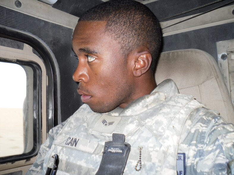 Airman Kevin Cain scans the surrounding area at the border crossing between Kuwait and Iraq. 