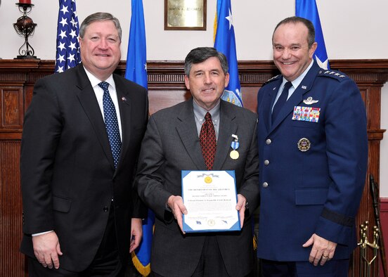 Michael Donley, Secretary of the Air Force, and Gen. Phillip Breedlove, Air Force Vice Chief of Staff, presented the Air Force Distinguished Public Service Award to retired Col. Tucker Fagan during a dinner in honor of the Air Force Chief of Staff Civic Leaders Feb. 2, 2001, at Joint Base Anacostia-Bolling. (U.S. Air Force photo by Michael J. Pausic)