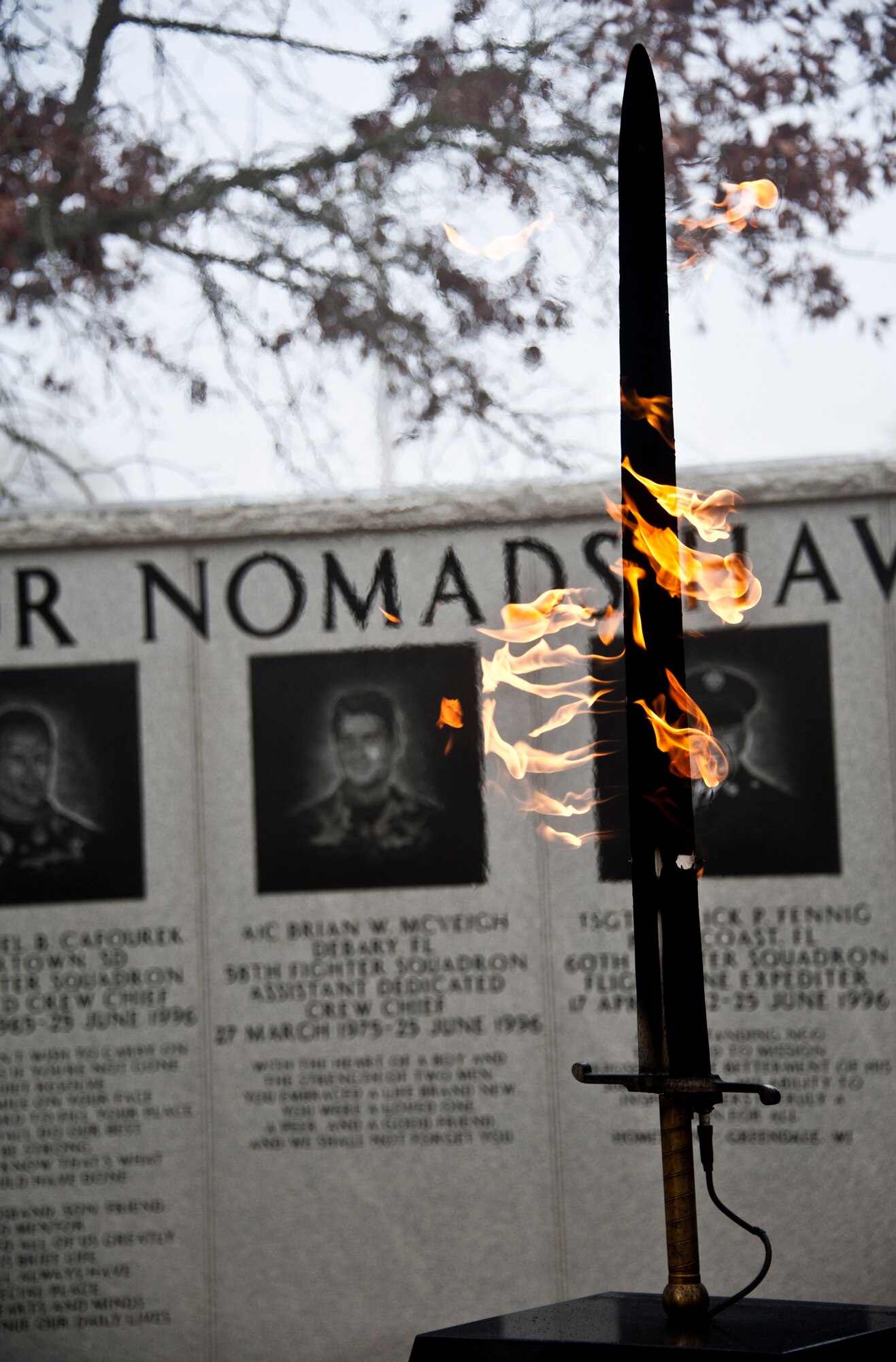 The fiery sword at the center of the Nomad Memorial burned bright through the foggy morning Feb. 18 at Eglin Air Force Base, Fla.  The memorial was constructed to honor the 105 wounded personnel and 12 Airmen who lost their lives during the Khobar Towers bombing.  June 25 will mark the 15th anniversary of the tragedy.   (U.S. Air Force Photo/ Samuel King Jr.)