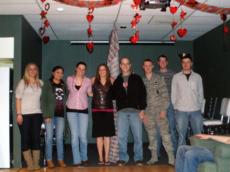 Eight contestants from the Detour's Love Match Valentine's game pose for a picture after the game ended.  They will all be receiving a dinner at Chili's sponsored by the Detour for their participation.  (Courtesy photo)