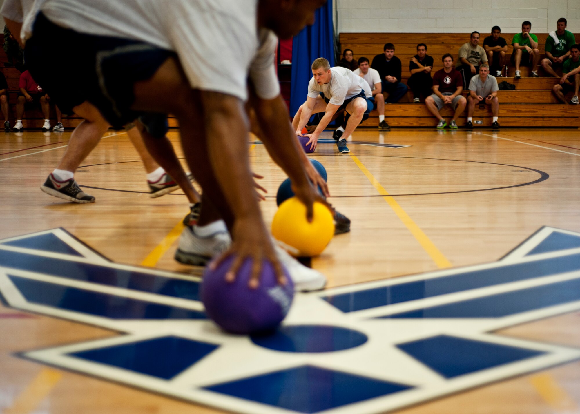 Two honor guard teams square off for bragging rights during their match at the dodgeball tournament at Eglin Air Force Base, Fla., Feb. 18.  The eventual winners were from the 40th Flight Test Squadron.  Team members were Guy Baldwin, Andrew Massino, Craig Zinck, Joe Markoff, and Chris Toves.  (U.S. Air Force photo/Samuel King Jr.)