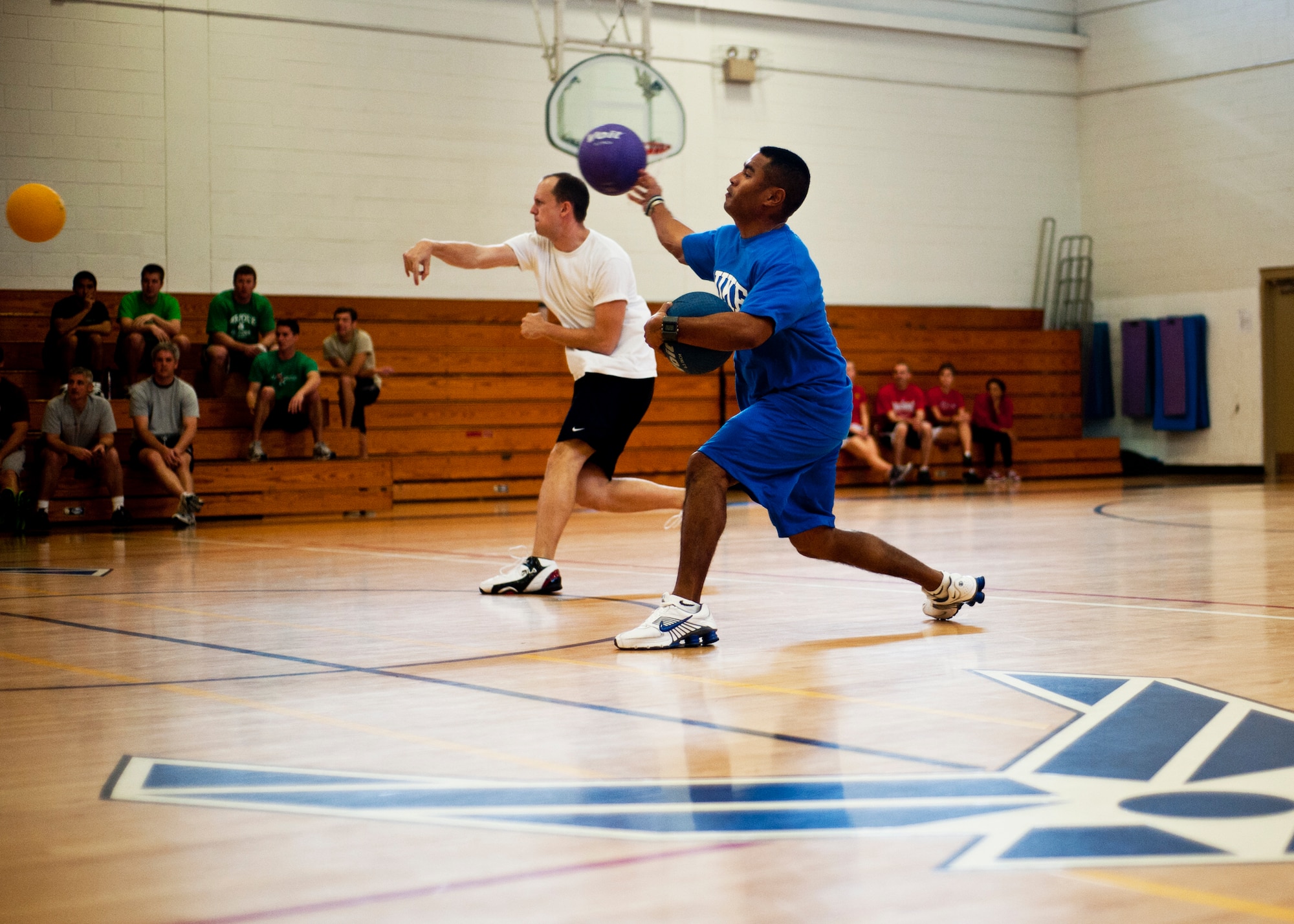 Two players fire their weapons during the dodgeball tournament at Eglin Air Force Base, Fla., Feb. 18.  The eventual winners were from the 40th Flight Test Squadron.  Team members were Guy Baldwin, Andrew Massino, Craig Zinck, Joe Markoff, and Chris Toves.  (U.S. Air Force photo/Samuel King Jr.)