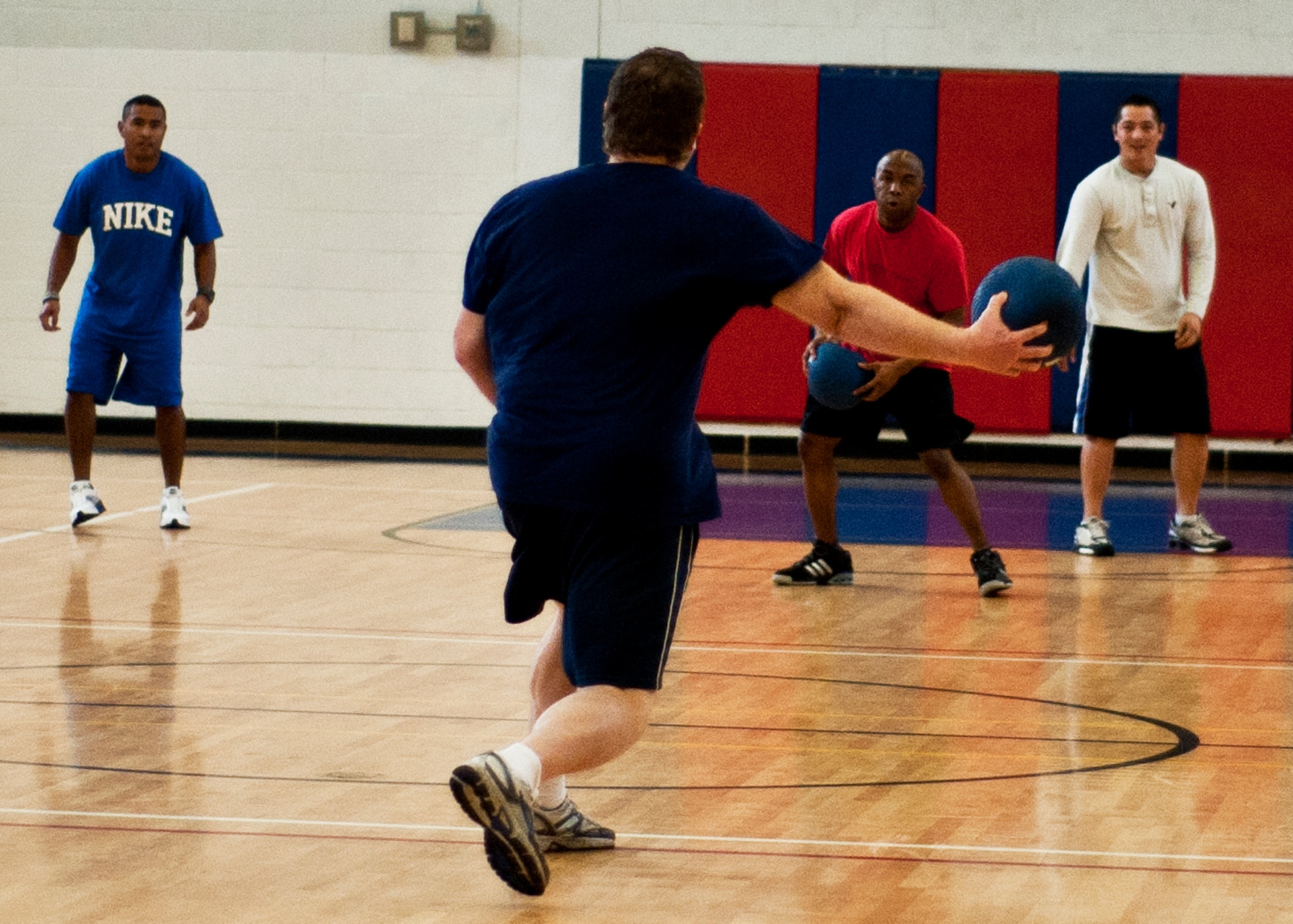 A sole survivor of the first match of the dodgeball tournament tries to take out one of his three opponents during the dodgeball tournament at Eglin Air Force Base, Fla., Feb. 18.  The eventual winners were from the 40th Flight Test Squadron.  Team members were Guy Baldwin, Andrew Massino, Craig Zinck, Joe Markoff, and Chris Toves.  (U.S. Air Force photo/Samuel King Jr.)