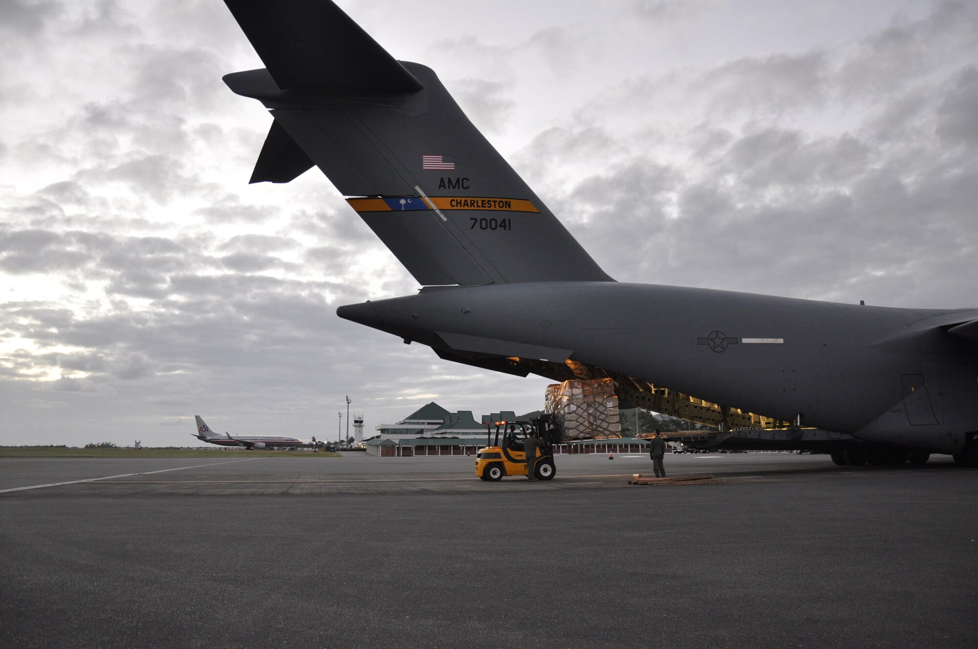 Reservists from the 315th Airlift Wing at Charleston Air Force Base deliver humanitarian aid to the Island nation of St. Lucia.  The C-17 Globemaster III delivered more than 11,000 pounds of supplies during the mission. (U.S. Air Force Photo\Capt. Wayne Capps)